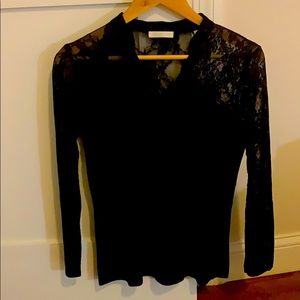 Black top with lace on arms and shoulders